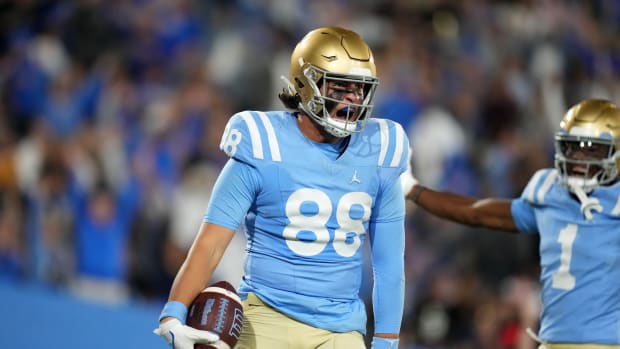 UCLA Bruins tight end Moliki Matavao celebrates after a touchdown.